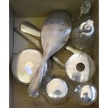 Five silver topped glass dressing table items, two silver topped scent bottles and other silverware