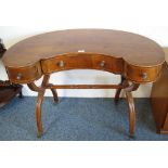 An Edwardian cross-banded and boxwood inlaid mahogany kidney shaped writing table with reeded X-