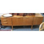 A McKintosh teak long low sideboard with three doors and three drawers, 201cm long