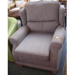 A grey upholstered armchair