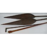 A near pair of South Sea Islands carved hardwood ceremonial paddles of typical leaf shaped form with