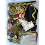 A selection of military badges, buckles, medals etc.