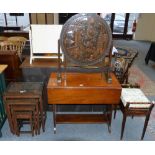 A Chinese nest of four carved camphorwood occasional tables with glass tops, a matching circular