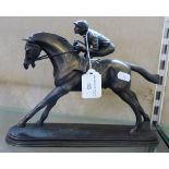 Bronzed resin figure of Jockey and race horse