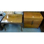 A Chinese hardwood baize lined chest with lift top over two cupboard doors enclosing four drawers,