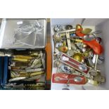 A selection of pocket knives in a tin together with various collector's spoons etc (2)