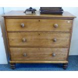 A Victorian satin walnut chest of three long graduated drawers on turned feet, 106cm wide