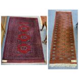 A geometric pattern rug with dark red background, 190cm x 122cm, together with a runner, 200cm x