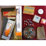 A box of miscellaneous including a Solitaire game, two Corgi models, card games and counters