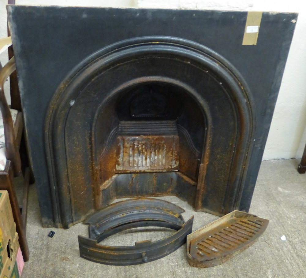 A cast iron fire inset together with ash can etc.