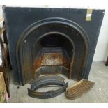 A cast iron fire inset together with ash can etc.