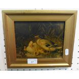 A gilt framed oil painting of a family of ducks