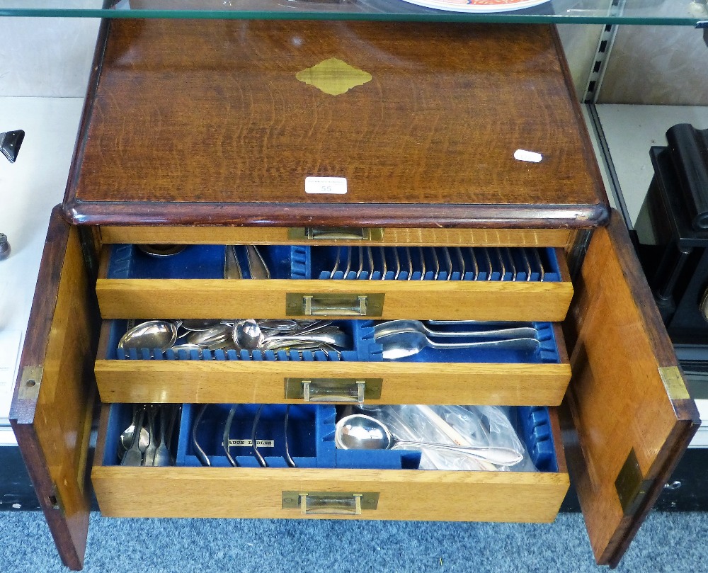 An oak four drawer canteen of cutlery