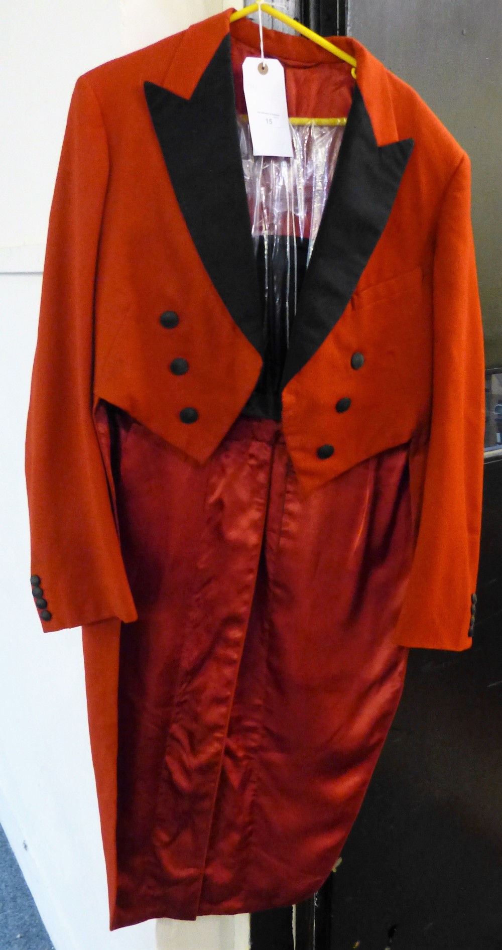 A red tailcoat and magician's folding top hat from Anderson and Machbet, Toronto