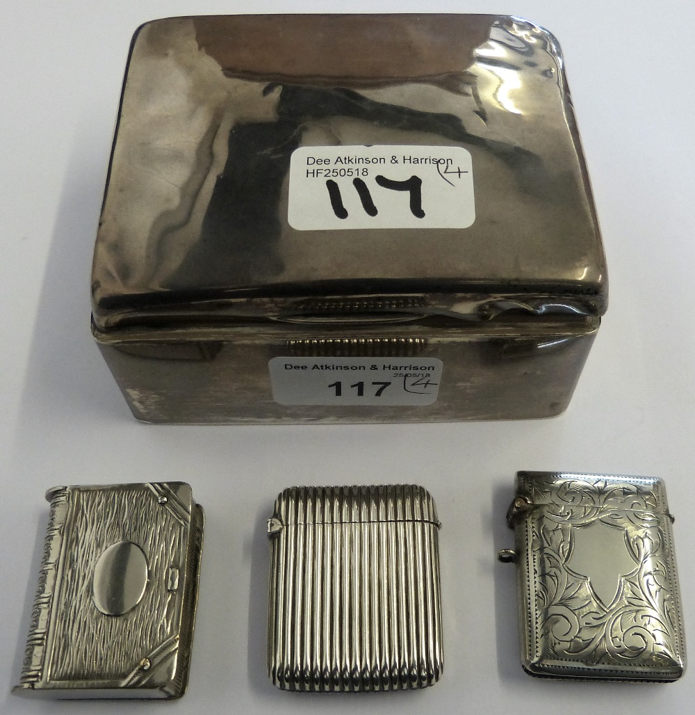 A silver cigarette box, marks worn, a Victorian silver vesta case Chester 1886 with ribbed