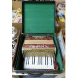 A Vissimio accordian in carrying case