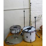 A part drum set, comprising two drums, three cymbals and stands