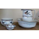 A four piece jug and bowl set decorated with birds