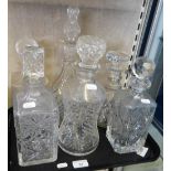 A collection of six cut glass decanters