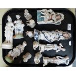 Thirteen continental figurines including a six piece child band