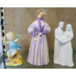 A Royal Worcester Freda Doughty fine bone china figure of a child together with Goebel figurine