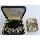 Silver charm bracelet, silver gilt and marcasite brooch and St. Christopher pendant on chain