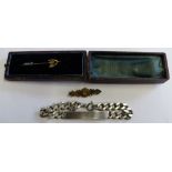 A 15ct gold bar brooch, a silver ID bracelet and a boxed stick pin