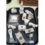 Thirteen items of crested china and a framed set of Beatles stamps