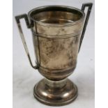 A silver two handled trophy cup, Birmingham 1951, of geometric form, uninscribed, height 16 cm,