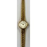 Tissot, a 9ct gold manual wind ladies wristwatch, London 1972, the silver dial with baton markings