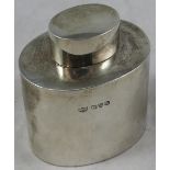 A silver tea caddy, Chester 1927, of plain oval form, pull off cover, height 8 cm, weight 2.5 oz.