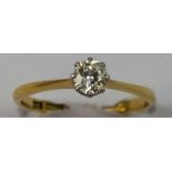 An 18ct gold single stone diamond ring, claw set with a brilliant cut stone weighing approximately
