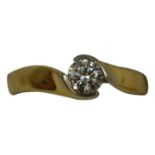 An 18ct gold single stone diamond ring, twist set with a brilliant cut stone weighing