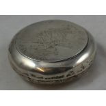 An Edwardian silver tobacco box, Birmingham 1903, of circular form, monogram, diameter 3.5 oz.