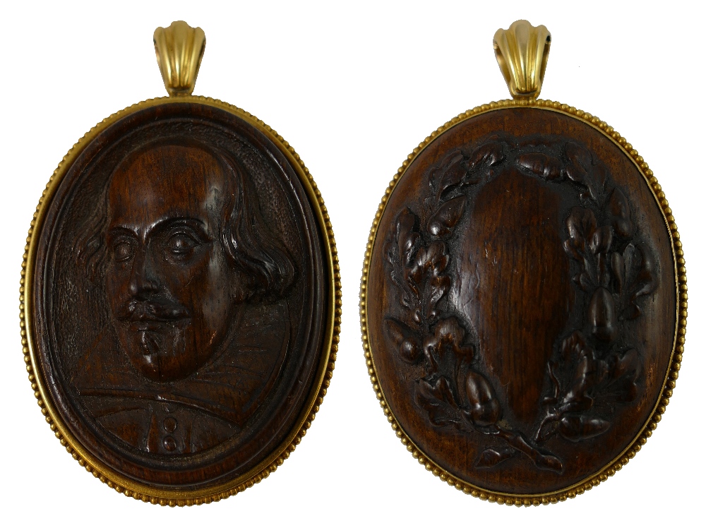 Of Shakespeare interest - A Victorian 18ct gold and believed Mulberry wood carved pendant, circa