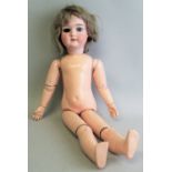 A Schoenau and Hoffmeister bisque head doll with applied hair, open mouth with teeth and composition