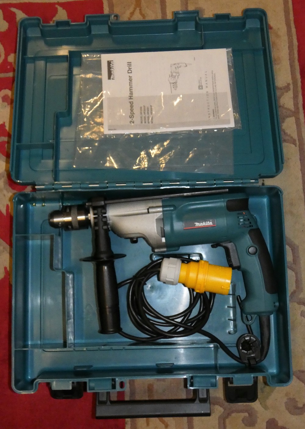 A Makita HP2050 two speed hammer drill 110v, unused, case