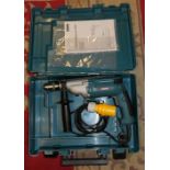 A Makita HP2050 two speed hammer drill 110v, unused, case