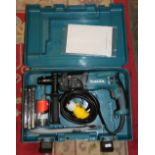 A Makita HR2470T rotary hammer drill, 110 volt, unused, case and accessories
