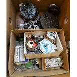 A box of fishing equipment, vintage reels, floats, etc.