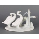 A Lladro matt group of 3 geese 22cm