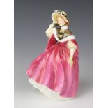 A Royal Doulton figure "Sunday Morning" HN2184 20cm