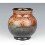 A William Moorcroft ribbed globular shaped vase, the base impressed William Moorcroft Potter to