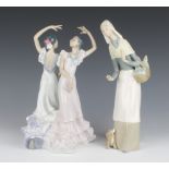 A Lladro figure of a standing lady with basket of French sticks 27cm and 1 other figure group of