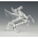 A Swarovski figure "Pegasus" No 216327/7400098000 designed by Adi Stocker, complete with stand and