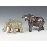 A Beswick figure of a standing elephant with trunk stretching forward no. 974 modelled by Arthur