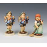 Three Hummel figures - boy with pig in basket and umbrella 198 13cm, Little Sweeper 12cm and another