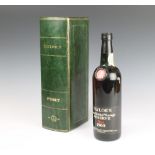 A bottle of 1965 Taylors late bottled vintage reserve port contained in a leather presentation box