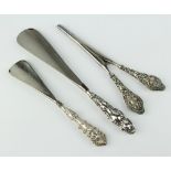 A pair of silver mounted glove stretchers and 2 shoe horns