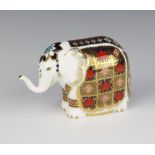 A Royal Crown Derby Imari pattern paperweight in the form of an elephant with silver stopper 9cm